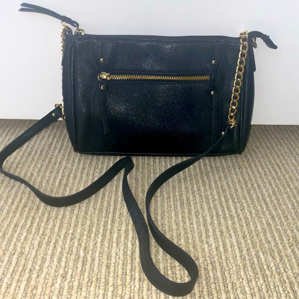 Black cross-body purse with gold chain detail